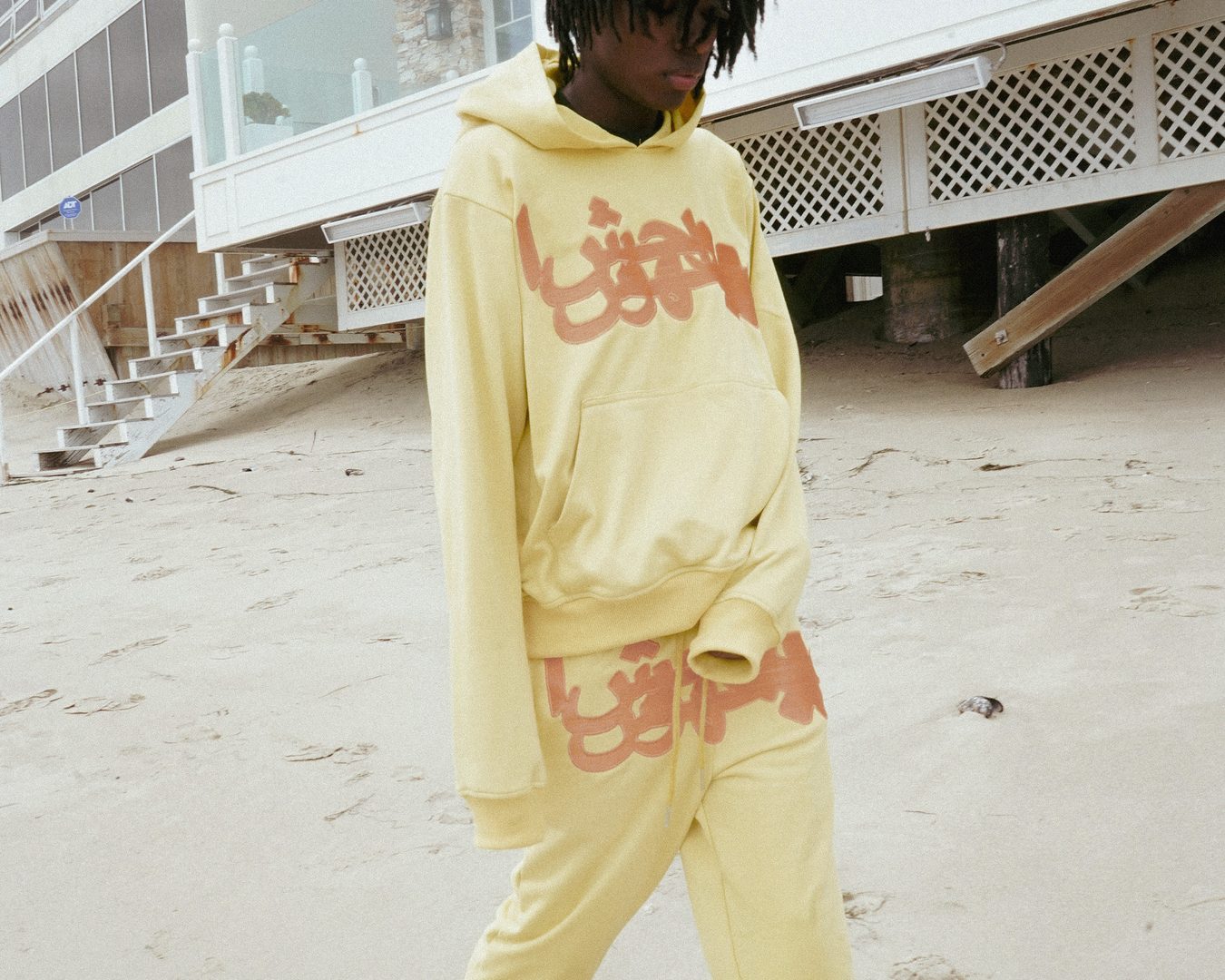 Yellow OG sweatsuit on the beach