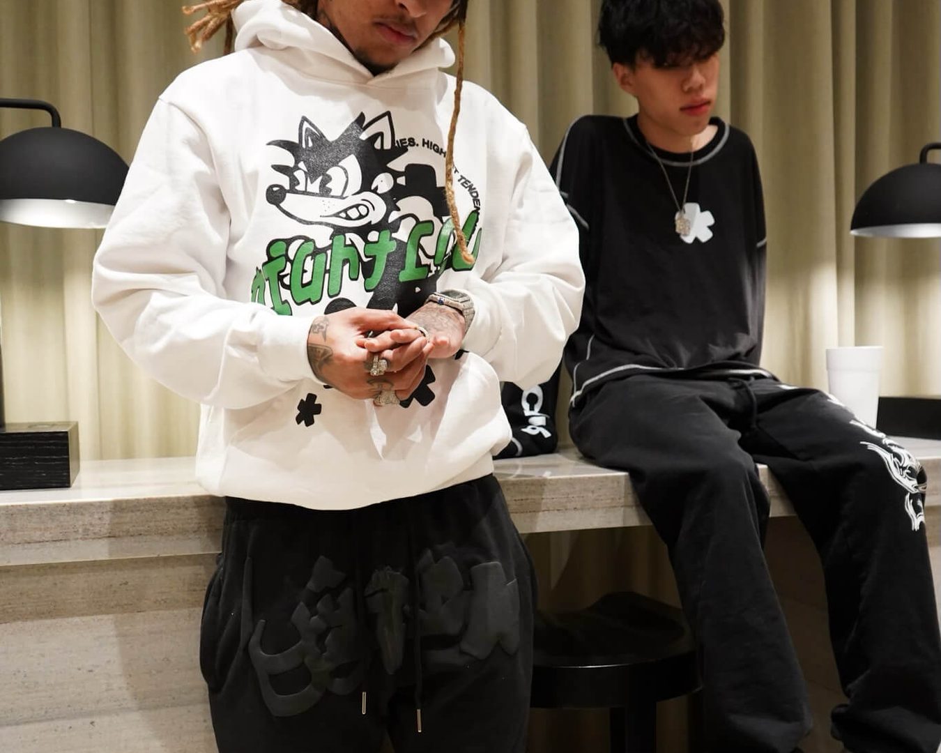 White graphic hoodie and black OG sweatpants